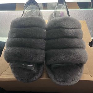 Women’s size 11 ugg yeah slides in dark grey.
